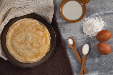 A stack of pancakes on the table for Maslenitsa. Pancake ingredients, Pancake recipe.