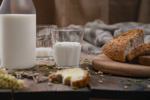 Rustic breakfast with milk and bread. World Milk Day on the first of June. Horizontal shot.