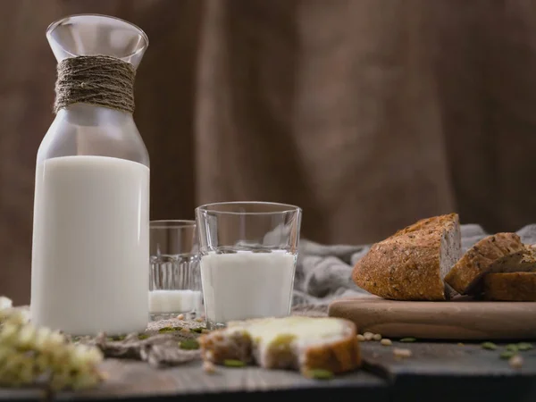Rustic breakfast with milk and bread. World Milk Day on the first of June. Horizontal shot.