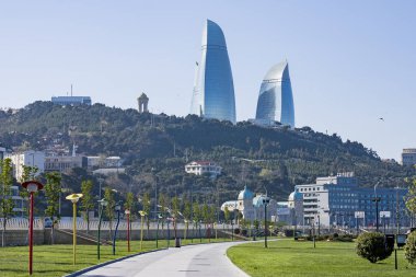 Azerbaijan, Baku- April 15, 2017; beautiful, high-rise, elegant buildings standing on a high mountain. Reflection of the city and the sea in the glass Windows of the building . Baku. Azerbaijan.