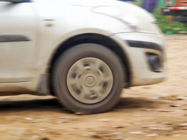 Side view of running car in high speed with motion blur