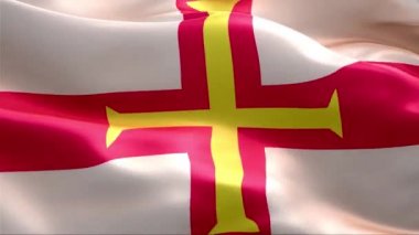 Guernsey bayrağı rüzgarda sallanıyor. 4K Yüksek Çözünürlük Tam HD. Guernsey Uluslararası Bayrağının Döngüleme Videosu.