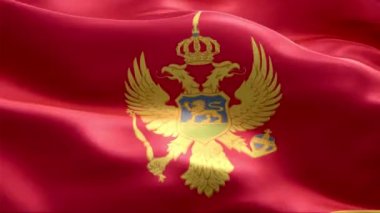 Karadağ bayrağı rüzgarda dalgalanıyor. 4K Yüksek Çözünürlük Tam HD. Karadağ Uluslararası Bayrağının Döngüleme Videosu.