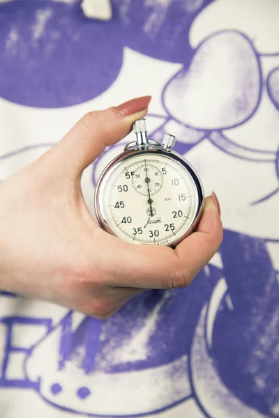 woman holding Vintage stopwatch