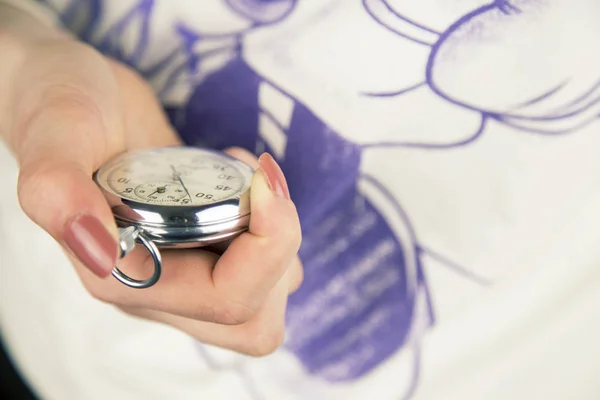 woman holding Vintage stopwatch