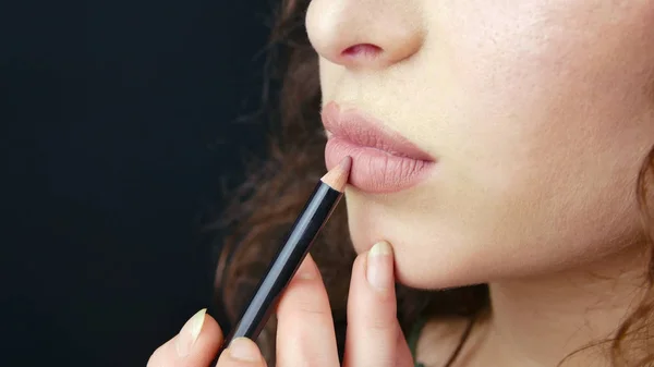 close up woman lips pencil