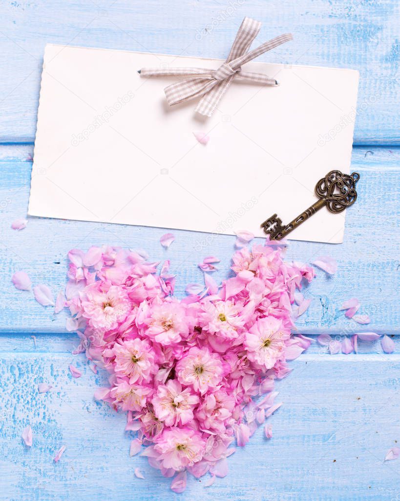 Heart from pink flowers and empty tag