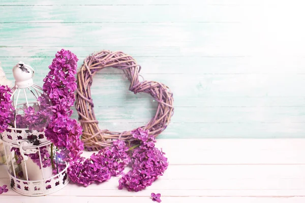 Violet lilac flowers, decorative heart and lantern — Stock Photo, Image