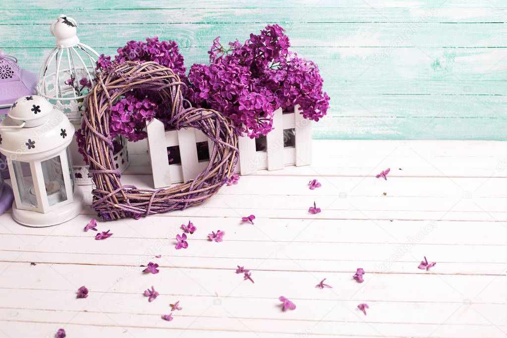 Fresh  lilac flowers, decorative heart  and lanterns