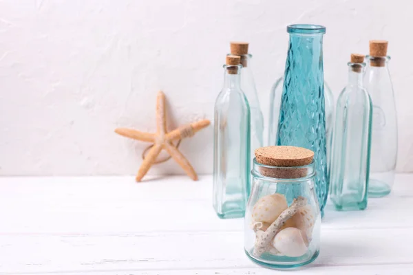 Decorative bottles, starfish and shells — Stock Photo, Image