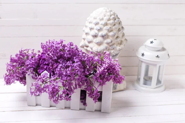 lilac flowers in box  and decorative lantern