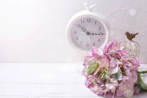 Pink hydrangea flowers and clock — Stock Photo, Image