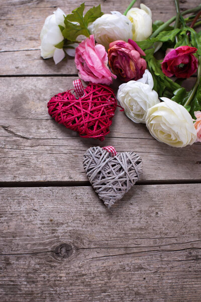 White and pink flowers and decorative hearts  