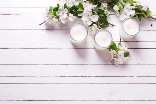 Apple Tree Flowers Three Candles White Wooden Background Selective Focus — Stock Photo, Image