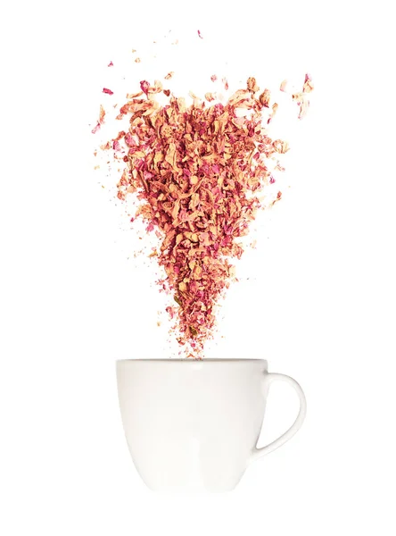 Healthy herbal tea concept. White tea cup and loose dried rose petals isolated on white background. Idea of an aromatic summer drink — Stock Photo, Image