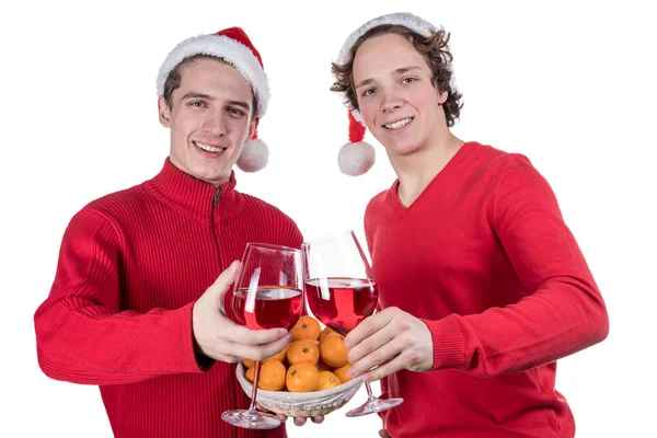 Två roliga unga män firar jul isolerad över vit bakgrund — Stockfoto