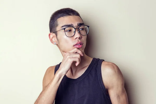 Young sexy man in glasses posing and looking at camera — Stock Photo, Image