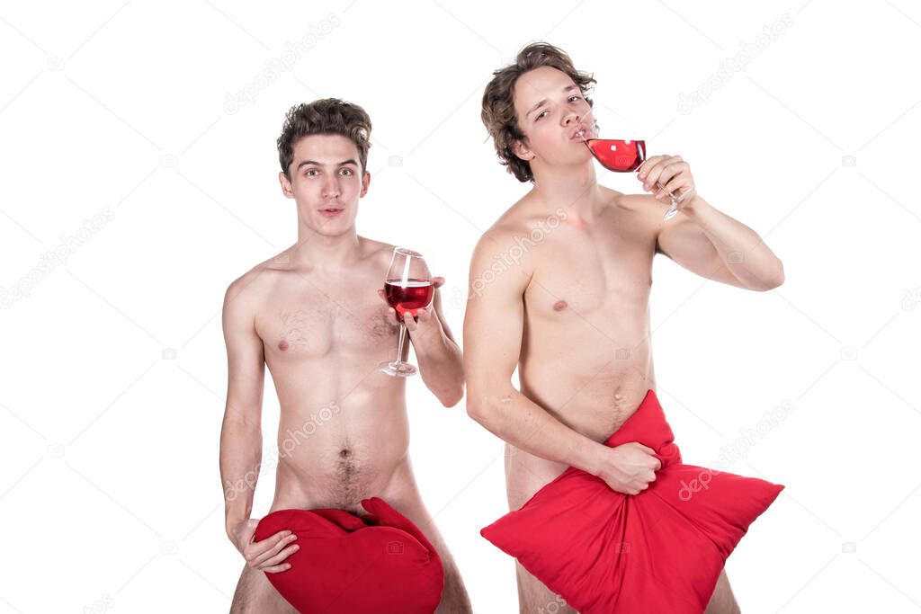 Two funny naked guys holding glasses with red wine and heart isolated on white