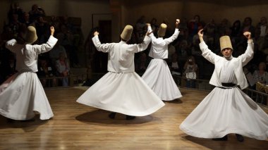 Cappadocia / Turkey - April 26, 2013: Sufi dance. Whirling Dervishes show. Sufi music. Cappadocia, Turkey