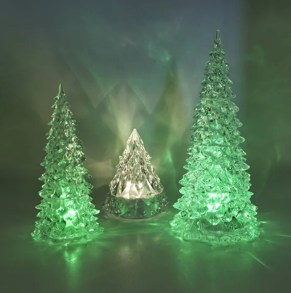 Illuminated Christmas trees on clear background