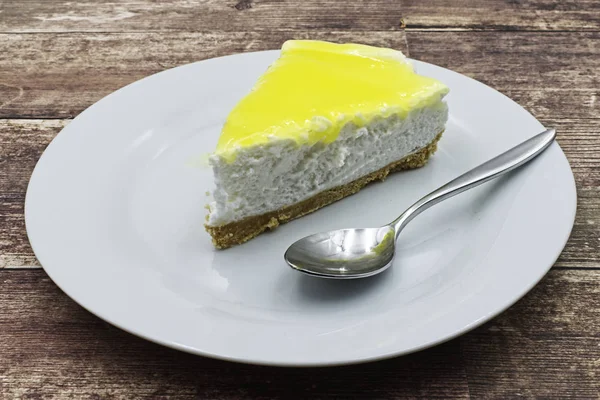 Slice Lemon Cheesecake White Plate Wooden Table — 스톡 사진