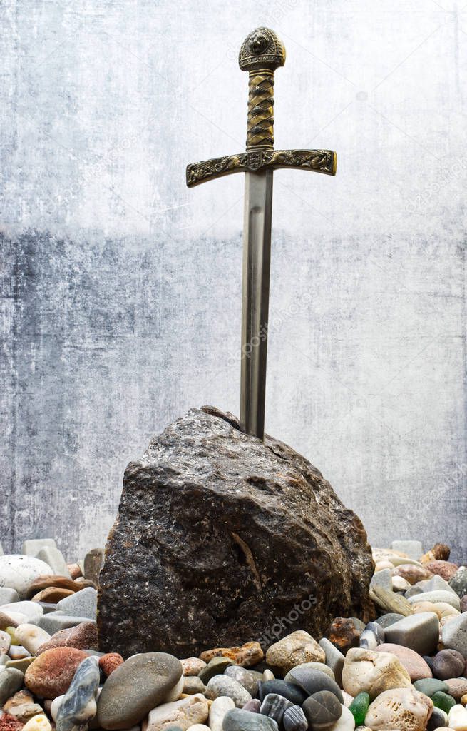 Excalibur, the mythical sword in the stone of King Arthur