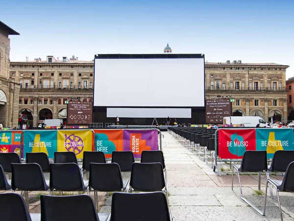 Outdoor cinema, white projection screen. Piazza Maggiore, Bologna. Italy