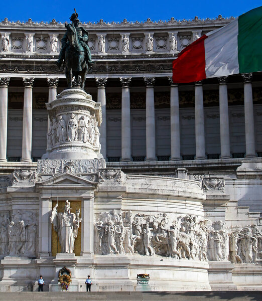 Rome / Italy - August 8, 2015: Tomb to the unknown soldier with the italian flag waving on the top right