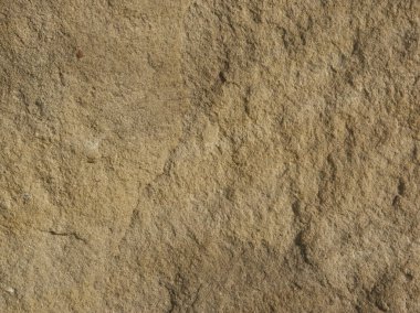 Günbatımında ışıklandırma efektlerini vurgulamak için makro içerikli turuncu taş desen resmi