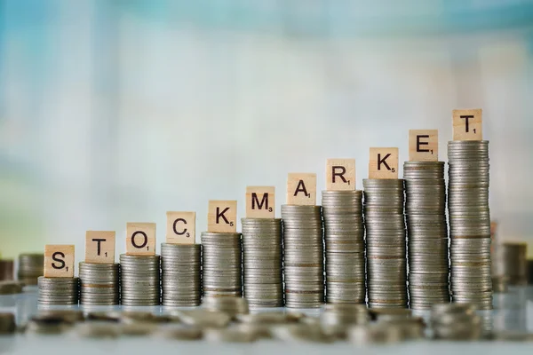 Stzck of Coins with Wooden Letters