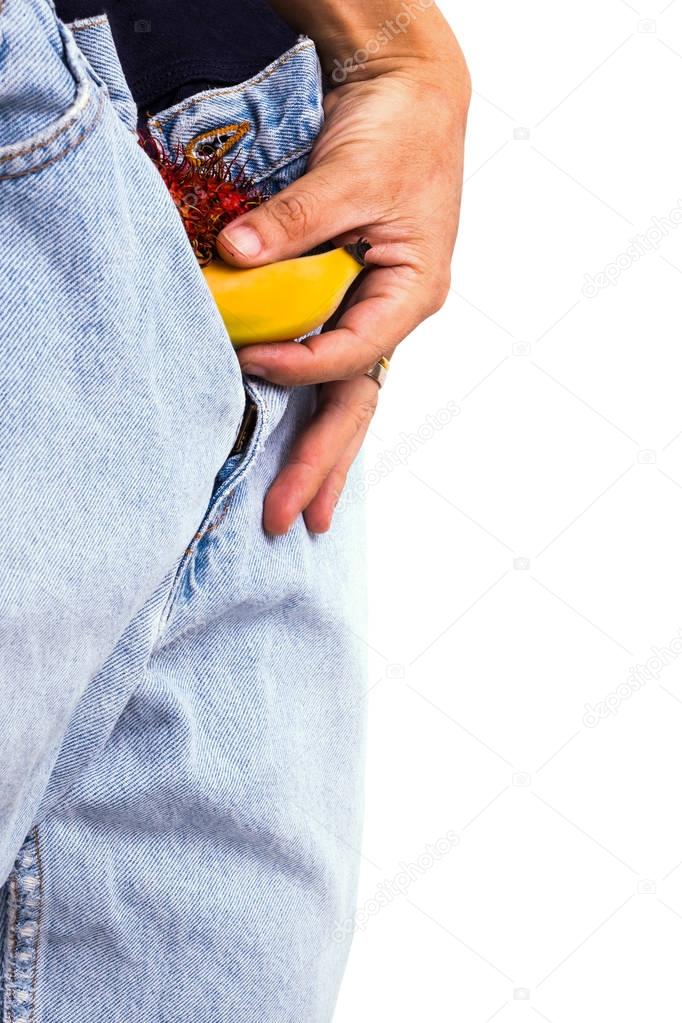 Hand Holds A Small Banana Sticks out of a Blue Jean Demonstraiti