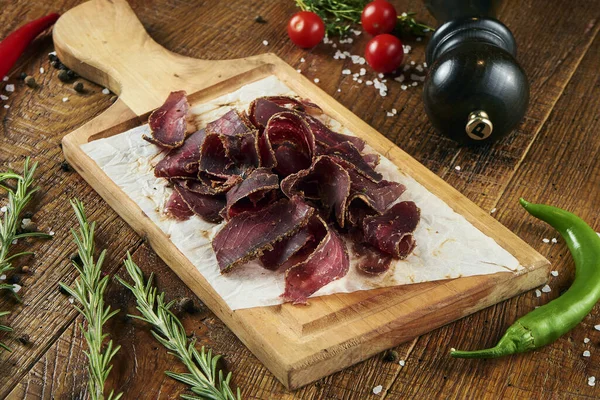 Close View Tasty Sliced Beef Jerky Pargovernment Wooden Board Wooden — Φωτογραφία Αρχείου