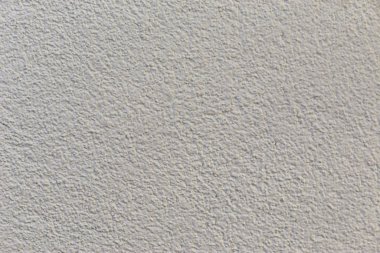 Dekoratif cephe sıvalarının dokuları. Çok renkli dış görünüş alçıya bakıyor.