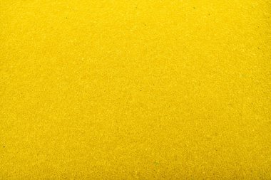 Arkaplan sarı renkli bal peteği yapısı şeklinde. Yakın çekim sünger. Parıldayan sarı sim dokusu..