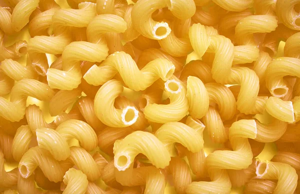 Pasta background texture.Raw pasta background close up