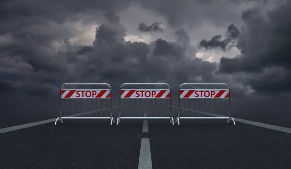 Asphalt road blocked by barriers with the words \