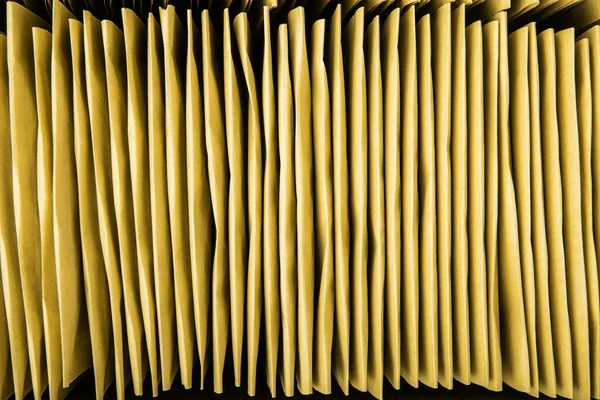 Stack of bubble envelopes inside a box. Close up, top view.