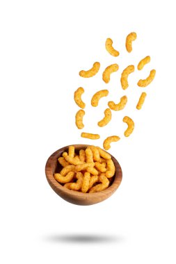 Puffed peanuts snacks falling in bowl. Isolated.