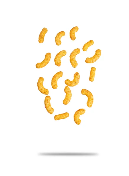 Puffed peanuts snacks falling. Isolated on white.