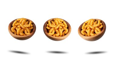 Puffed peanuts snacks in wooden bowls. Isolated.
