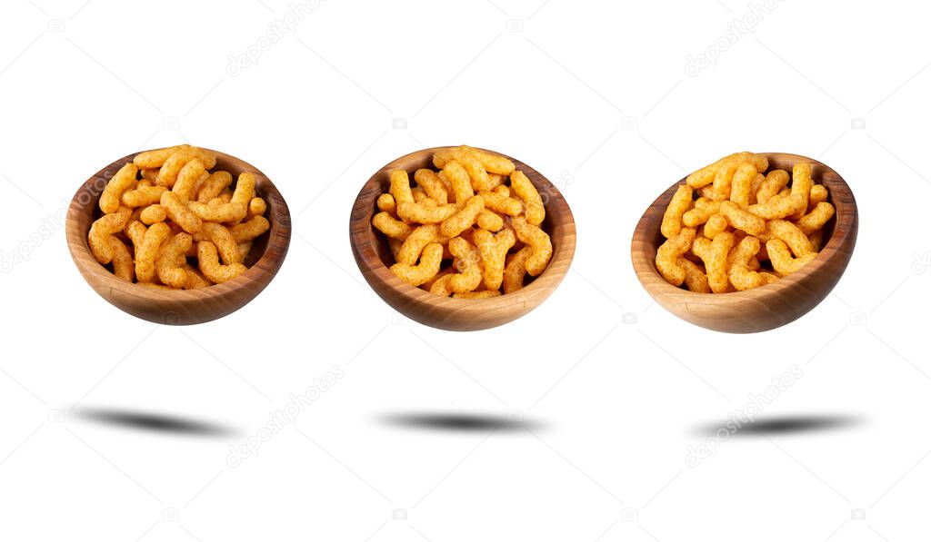 Puffed peanuts snacks in wooden bowls. Isolated.