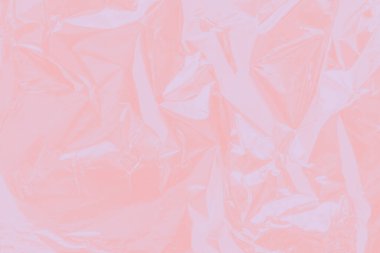 Yumuşak, açık pembe, bulanık arkaplan. Alüminyum folyo.