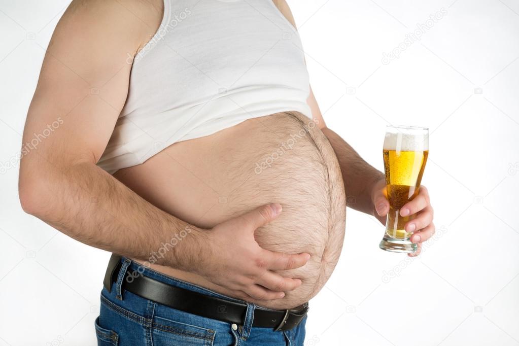 closeup fat belly with beer isolated on white background