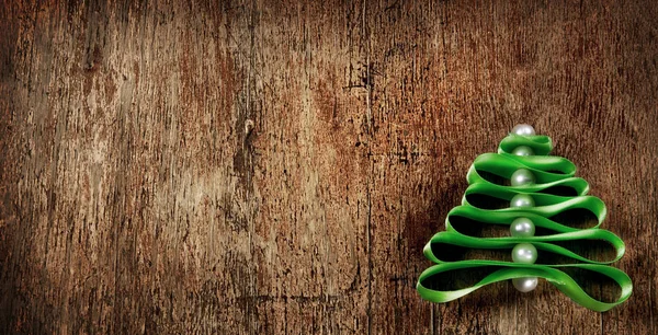 Christmas tree made from green ribbon on wooden background — Stock Photo, Image