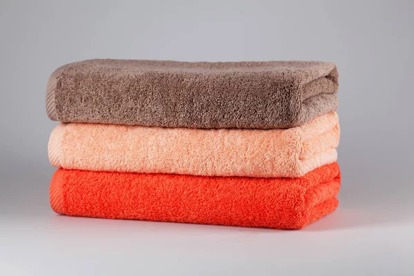 Three bath towels of different colors — Stock Photo, Image