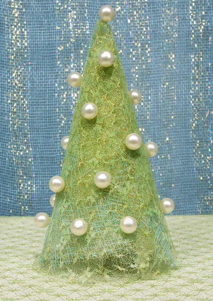 Nový rok strom látky zdobené korálky. — Stock fotografie