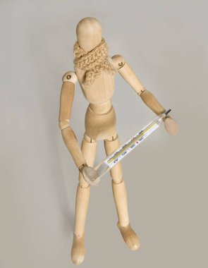 bir kukla eşarp ve termometre