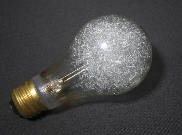 Magnesium flash lamp on a fabric background.