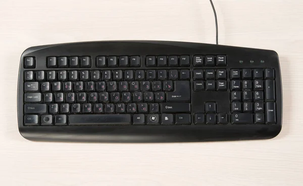 Old and black wired keyboard — Stock Photo, Image