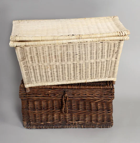 a wicker box on a gray background